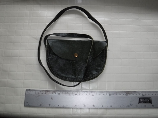 A small, dark blue leather bag