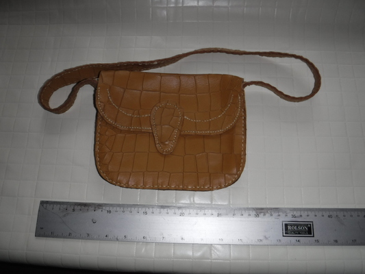 A small, brown ladies bag