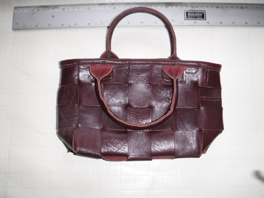 A brown, woven ladies' bag