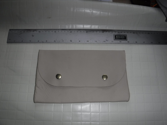 A light-grey clutch bag