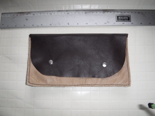 A two-tone clutch bag